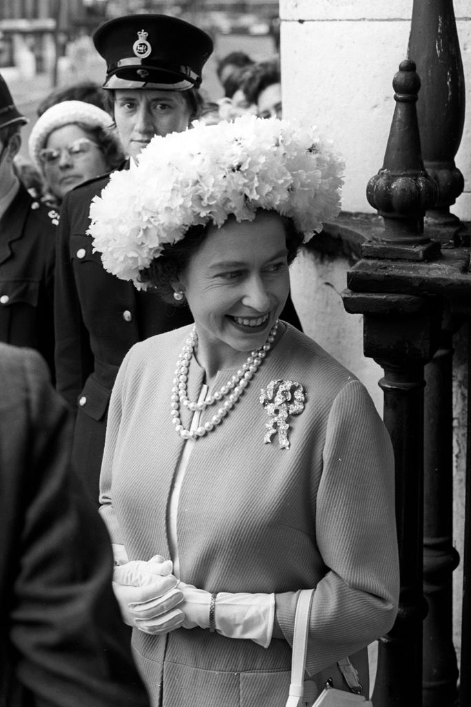 Queen Elizabeth II wearing a petal hat at the wedding of the Marquess of Hartington