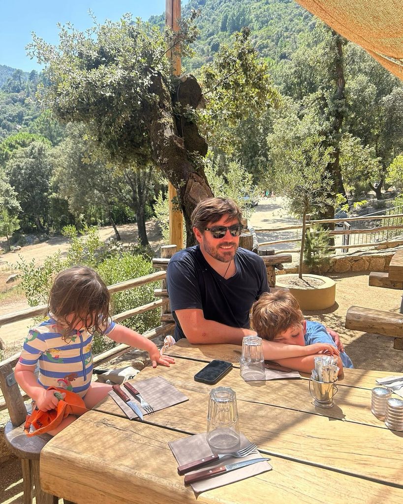 father with two kids on holiday