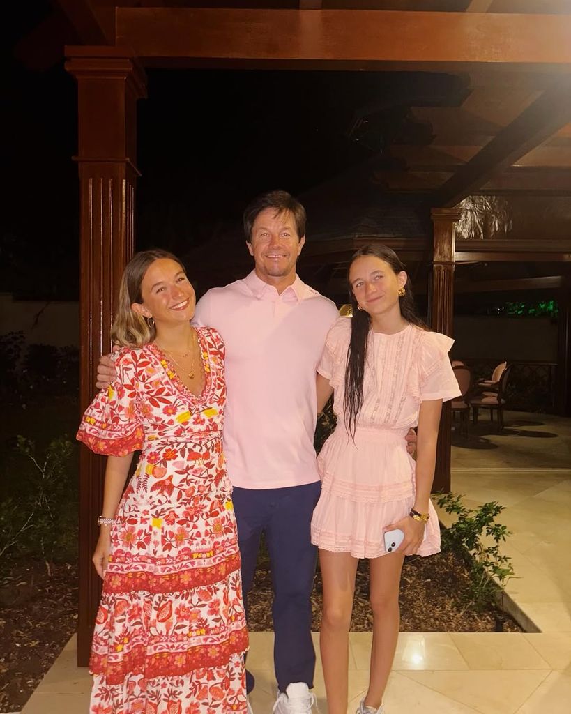 Mark posed with his daughters for a sweet photo