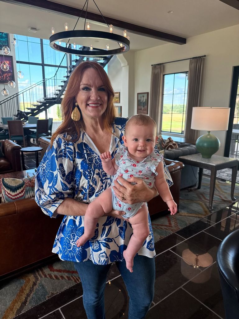 ree drummond holding baby granddaughter in her arms