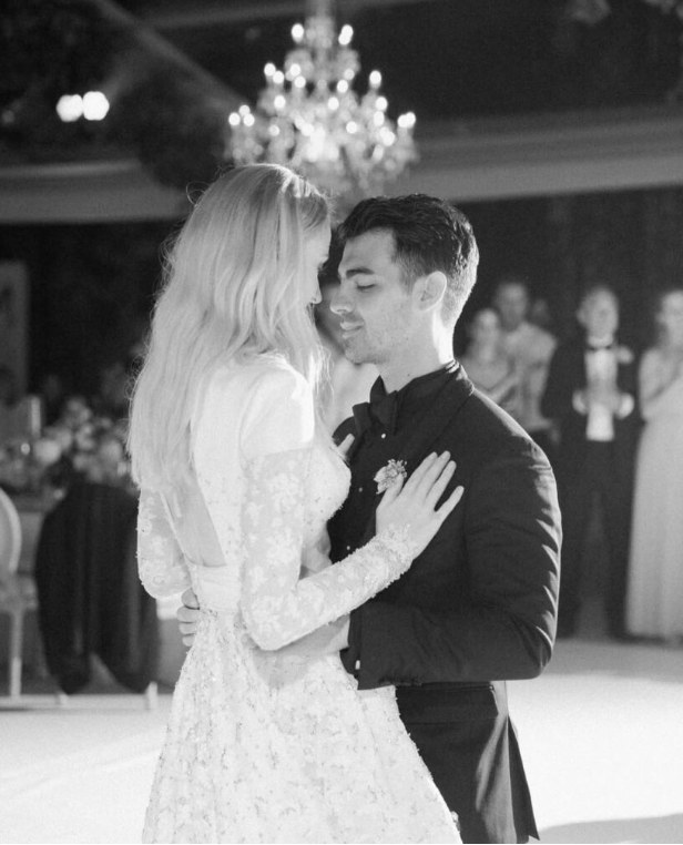Sophie Turner facing Joe Jonas in a wedding dress for their first dance
