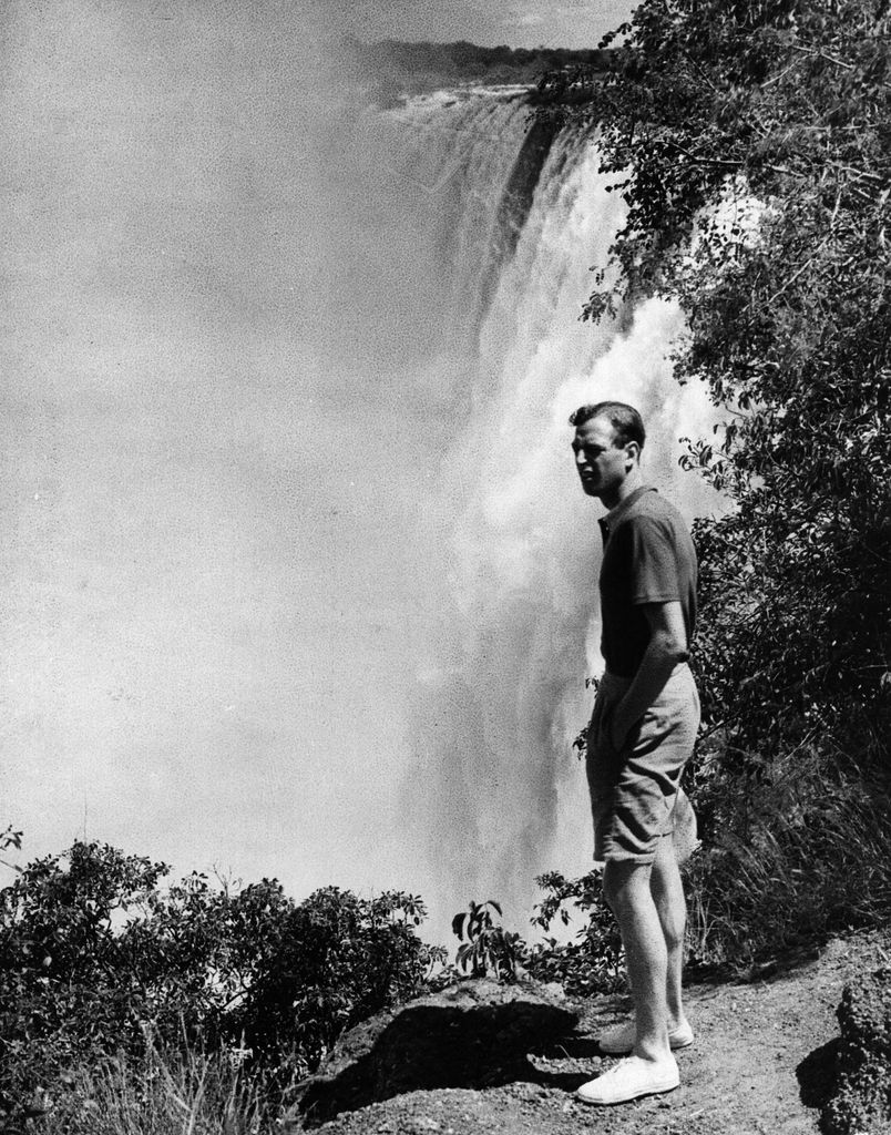 Prince George, Duke of Kent stood next to a waterfall