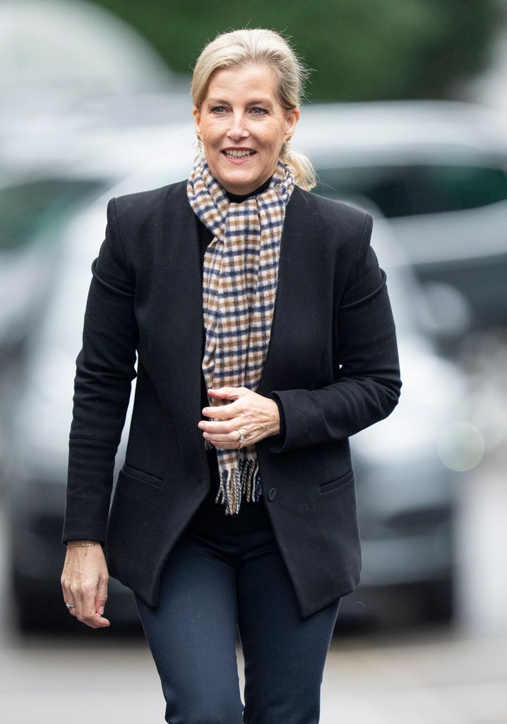  Sophie in black blazer and plaid scarf