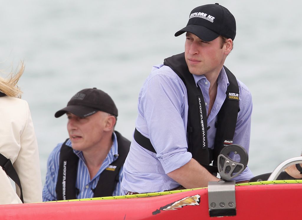 Prince William and Jamie Lowther-Pinkerton on a boat