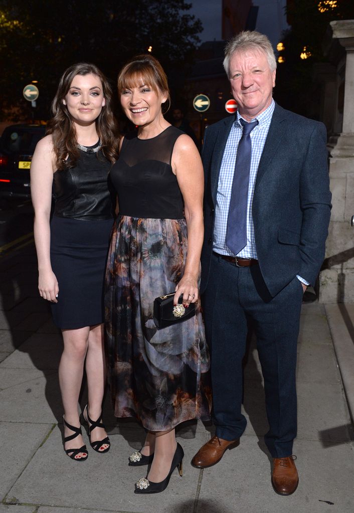 Lorraine Kelly in a black dress with her husband Steve Smith and daughter Rosie