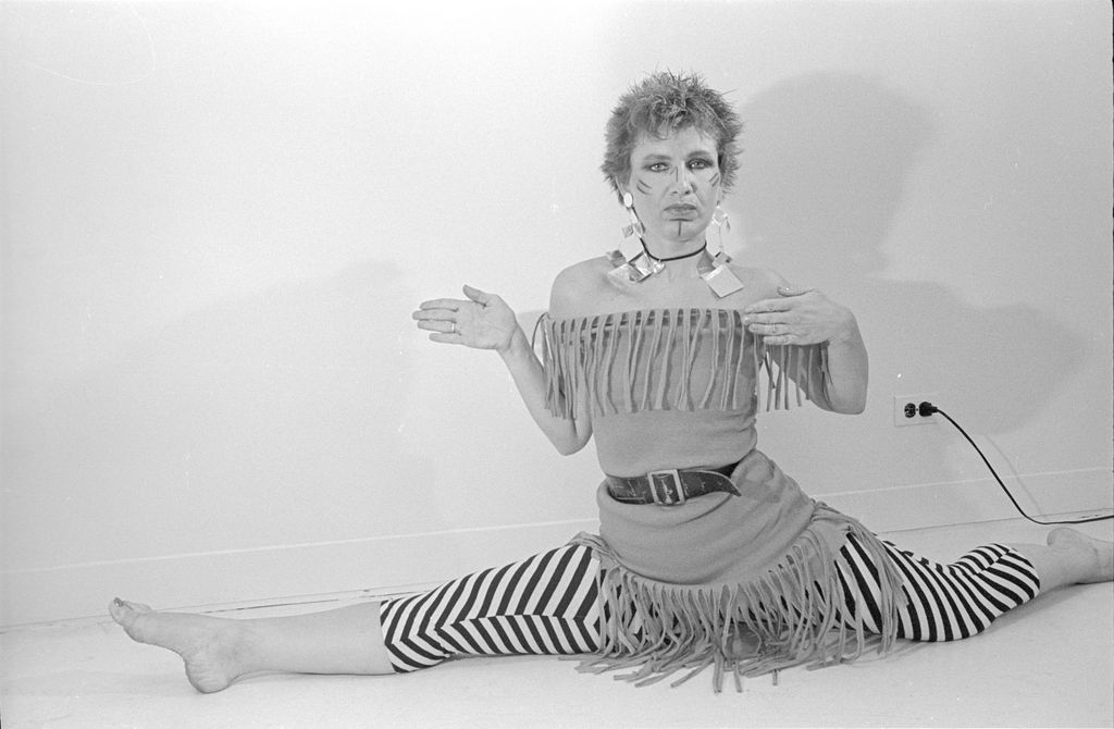 Portrait of American fashion designer Betsey Johnson as she does the 'splits' in her studio, New York, New York, July 9, 1980