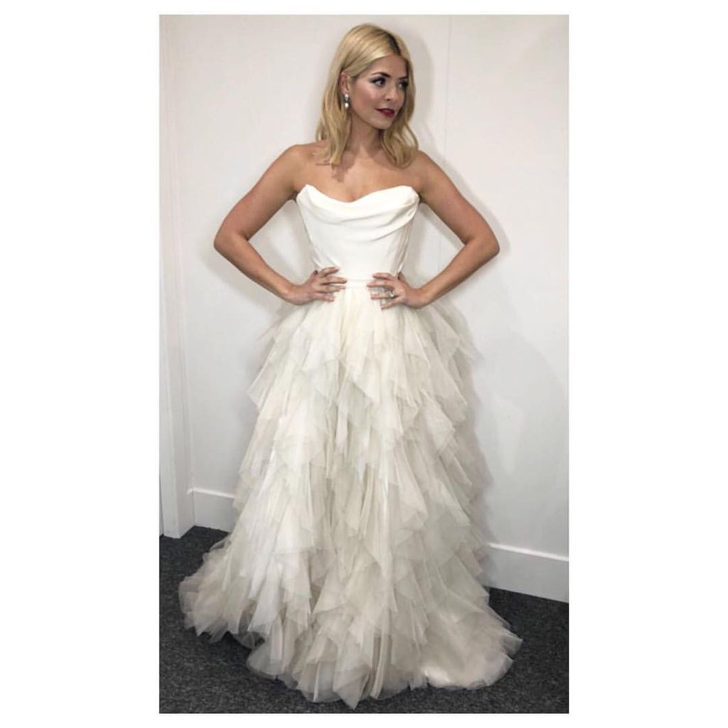 Holly Willoughby in a ruffled strapless white dress