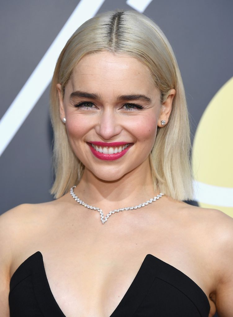 Actor Emilia Clarke arrives to the 75th Annual Golden Globe Awards with blonde hair