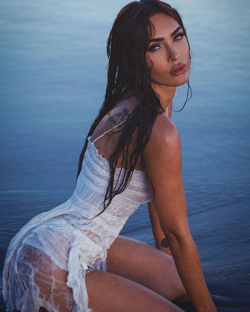 Megan Fox models seethrough white dress