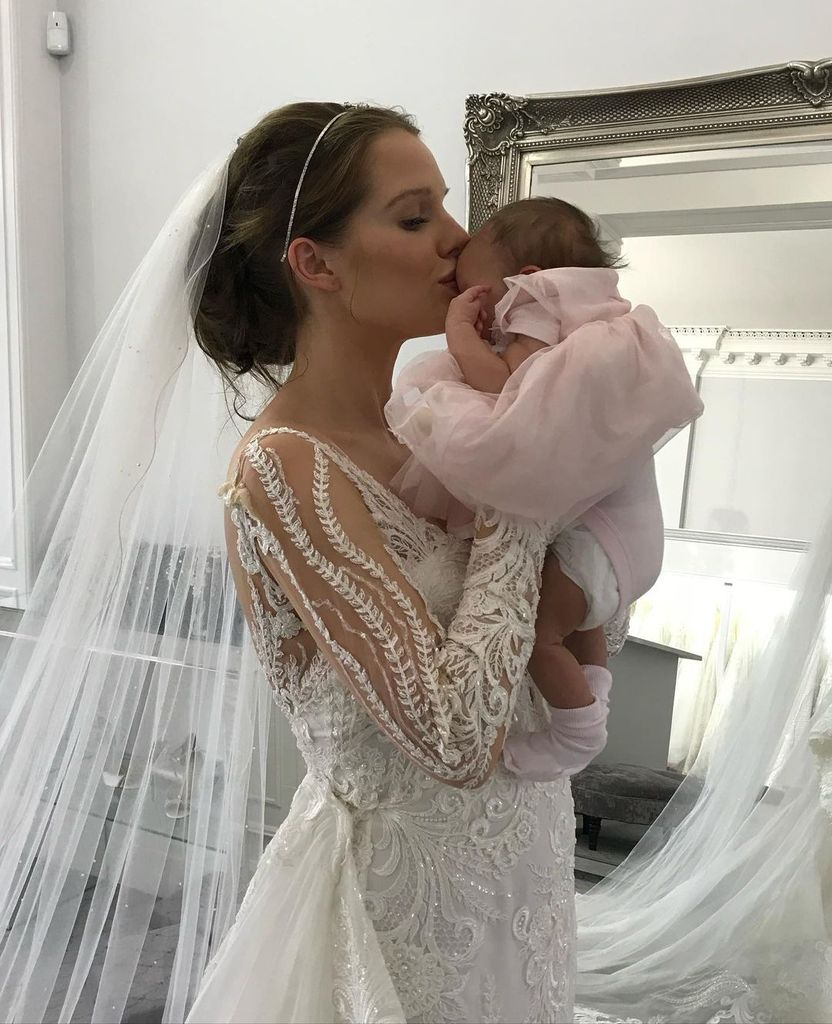 Helen Flanagan kisses baby daughter in an embellished wedding dress