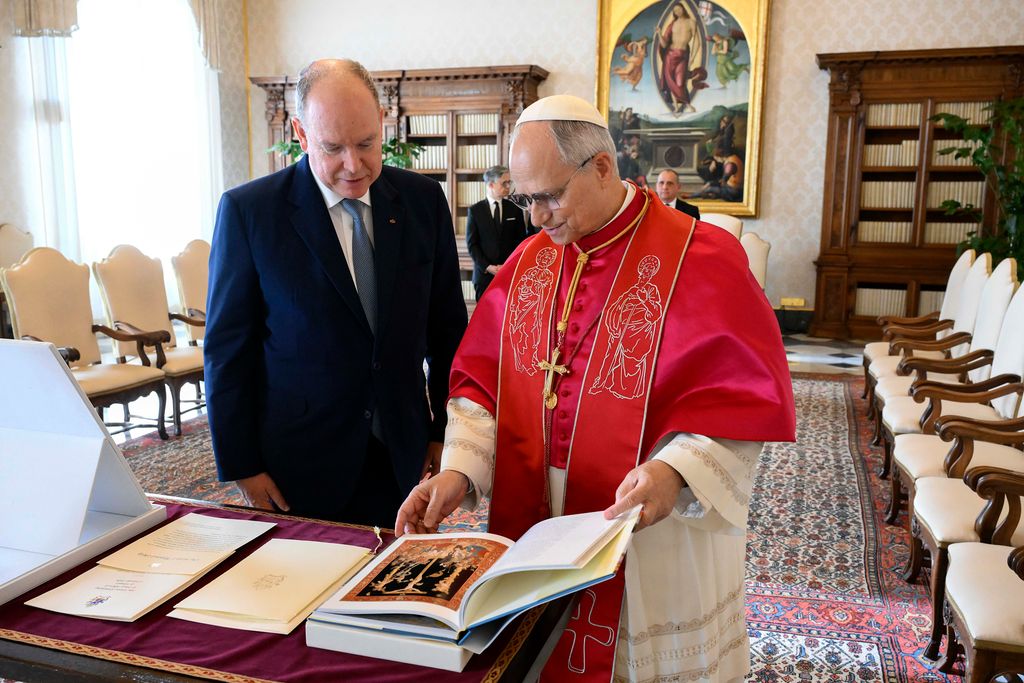 Prince Albert and Pope Leo XIV looking at a book