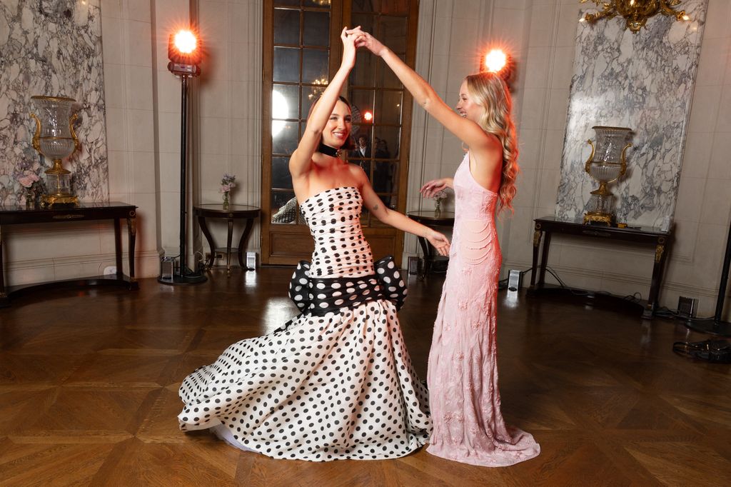 Ruby Kemper and Carolina B. Lansing dancing in ball gowns
