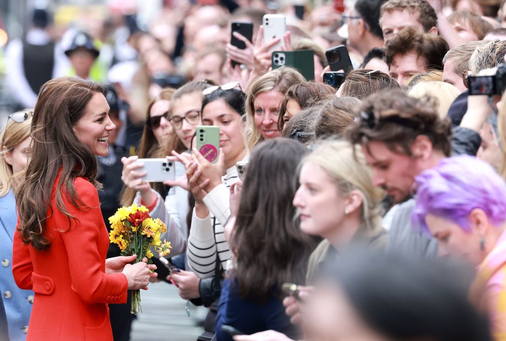 Kate Middleton speaking to a crowd of people