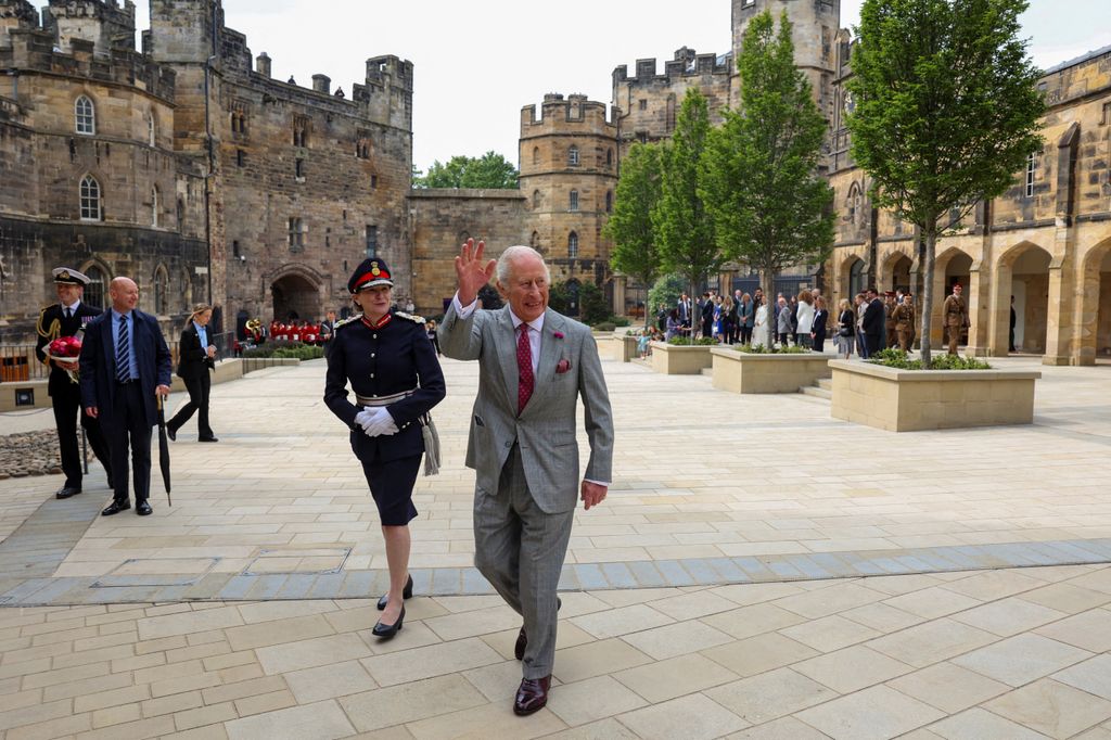 King Charles waving outside Lancaster Castle