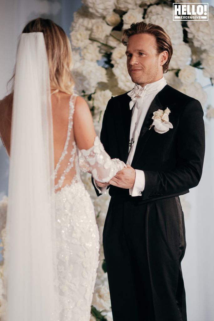 Olly Murs admires his bride at the altar