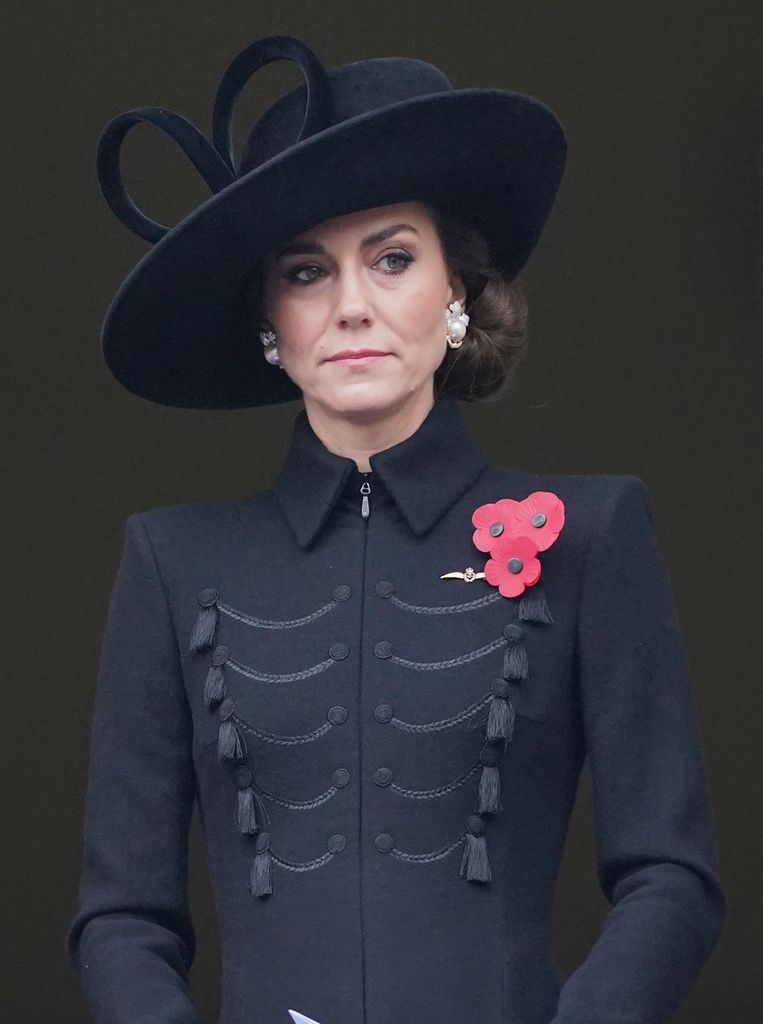 Kate Middleton wearing black military jacket and pearl earrings for Remembrance