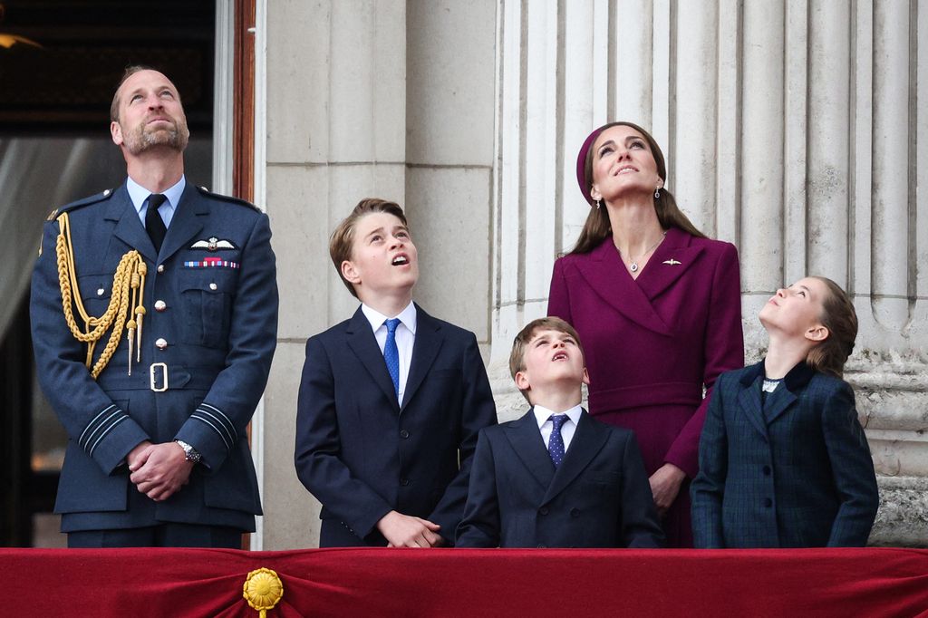 William, Kate, George, Charlotte and Louis look up at flypast