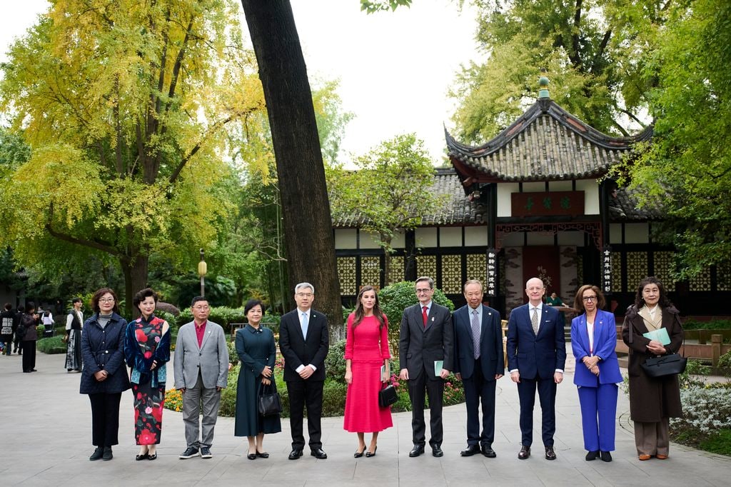 Queen Letizia and King Felipe VI in line up of people outside chinese memorial 
