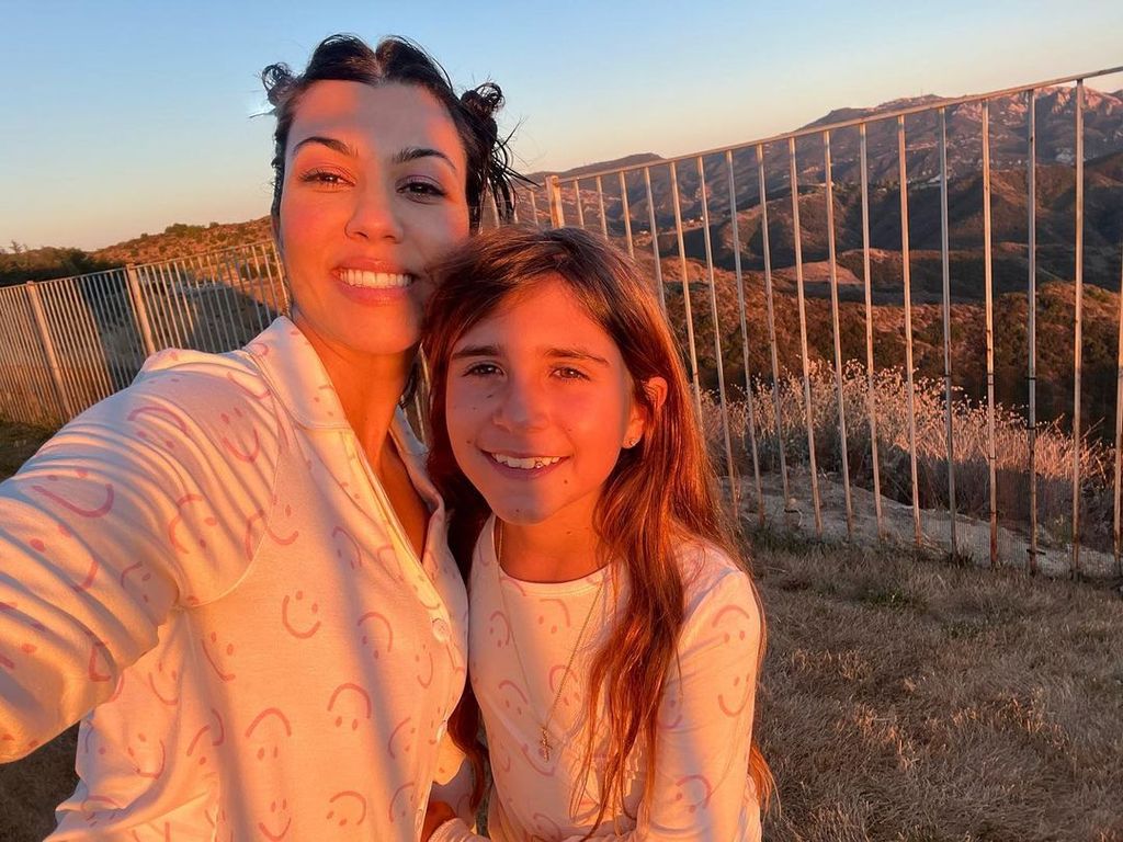 Kourtney with her daughter Penelope posing for a selfie at dawn