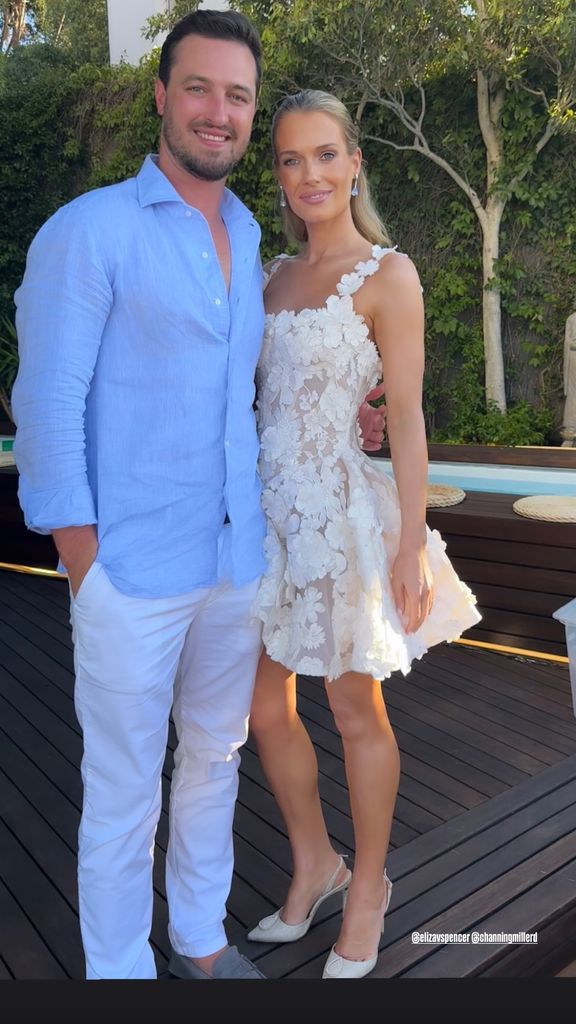 eliza spencer in white dress and channing millerd in blue shirt outside 