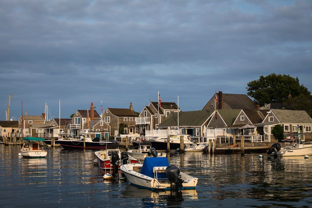 Evening light falls on boats as they bob in the harbor of Nantucket, MA on Aug. 13, 2020. Over the past several years, Nantucket police have failed to investigate crimes in which Black or immigrant residents are the victims. Residents want answers and proper justice to be served.