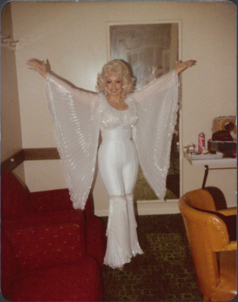 Dolly Parton wearing a white outfit