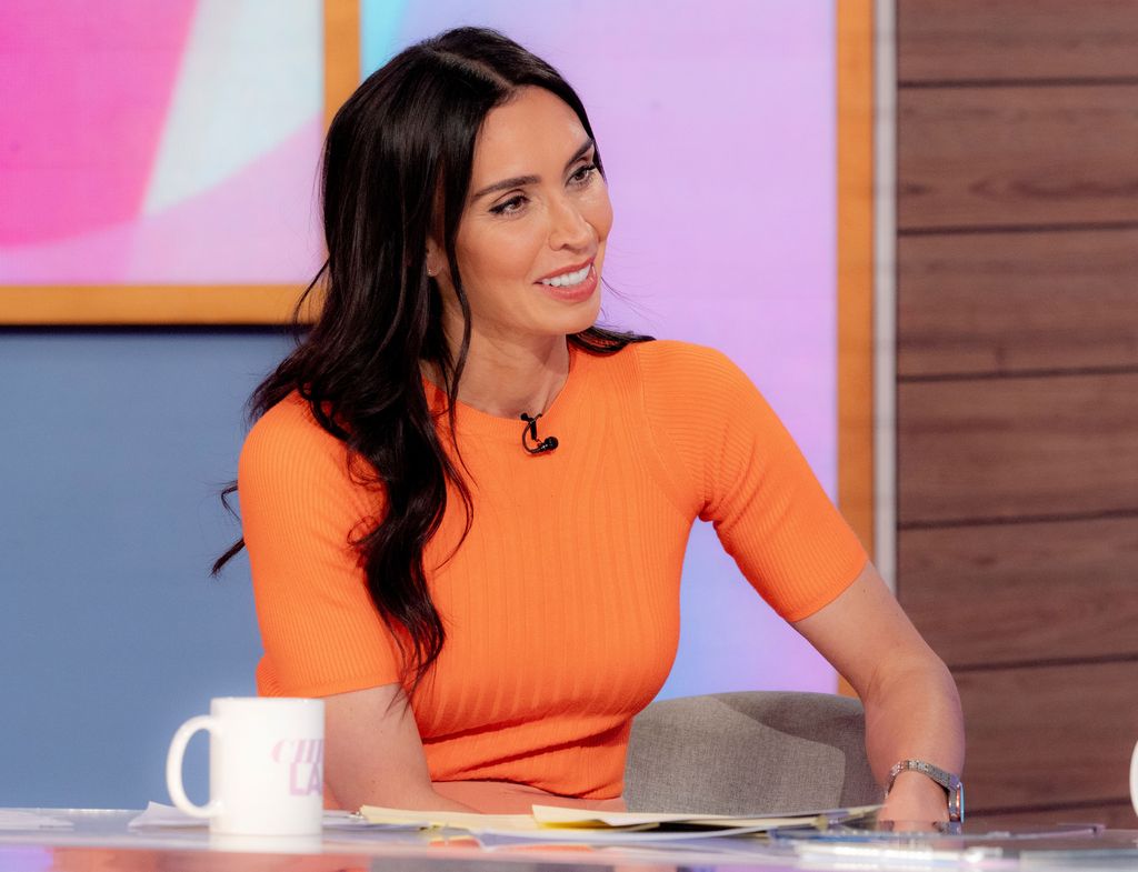 Christine Lampard wearing an orange top from Marks & Spencer