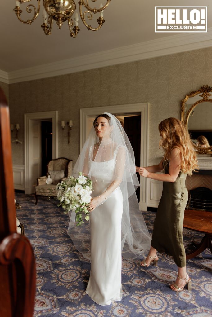 Faye Harris putting on her wedding dress