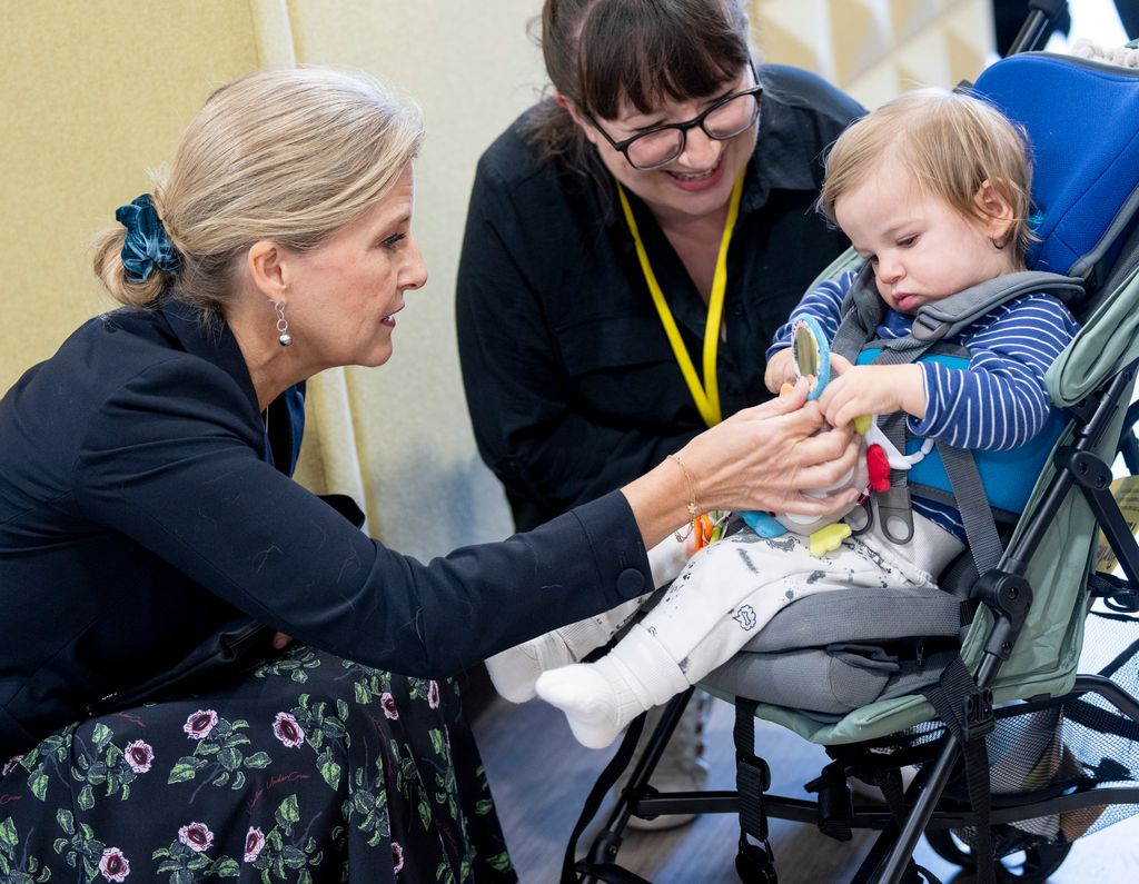 Sophie, Duchess of Edinburgh Patron, meets "Storm" as she attends the Buddy Dogs Family Event at the Guide Dogs UK centre on October 31, 2024 in Reading, England. 