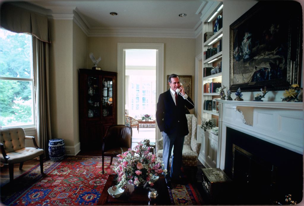 Vice President George H.W. Bush answers a phone call in the Vice President's Residence circa 1983 in Washington, DC.