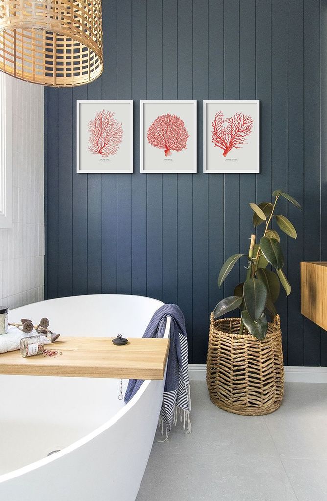 Bathroom with navy wooden panelling and coral wall art