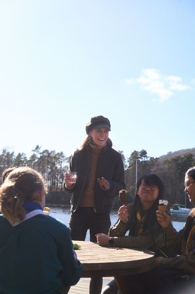 Kate Middleton drinking water while Scouts enjoy ice cream