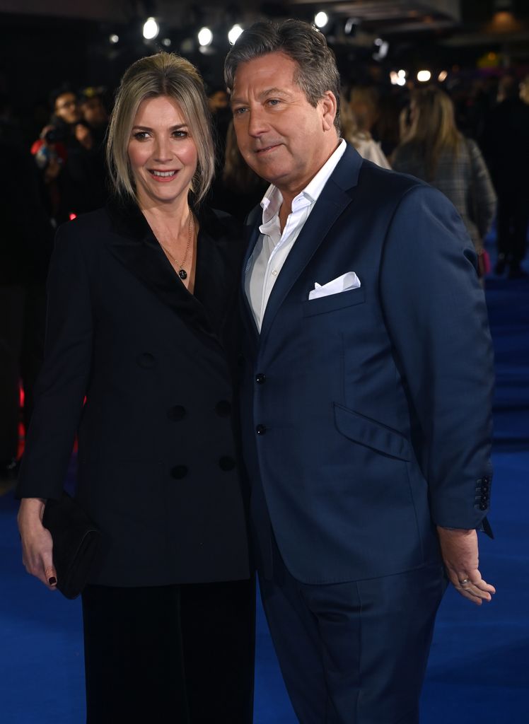 Lisa Faulkner in a black dress and John Torode in a blue suit