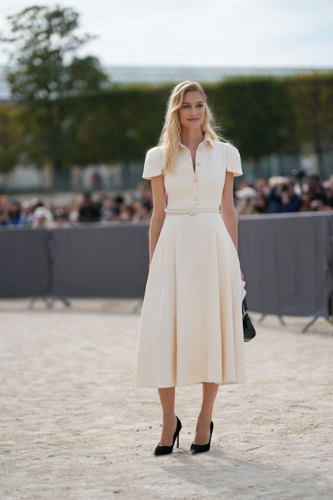 Beatrice Borromeo wears a white gathered midi dress, a belt, black pumps / shoes, outside Dior, during the Womenswear Spring/Summer 2024 as part of Paris Fashion Week on September 26, 2023 in Paris, France.