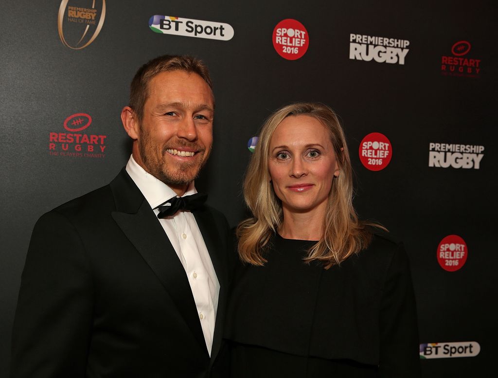 Jonny Wilkinson in a black tuxedo standing with Shelley Jenkins in a red dress