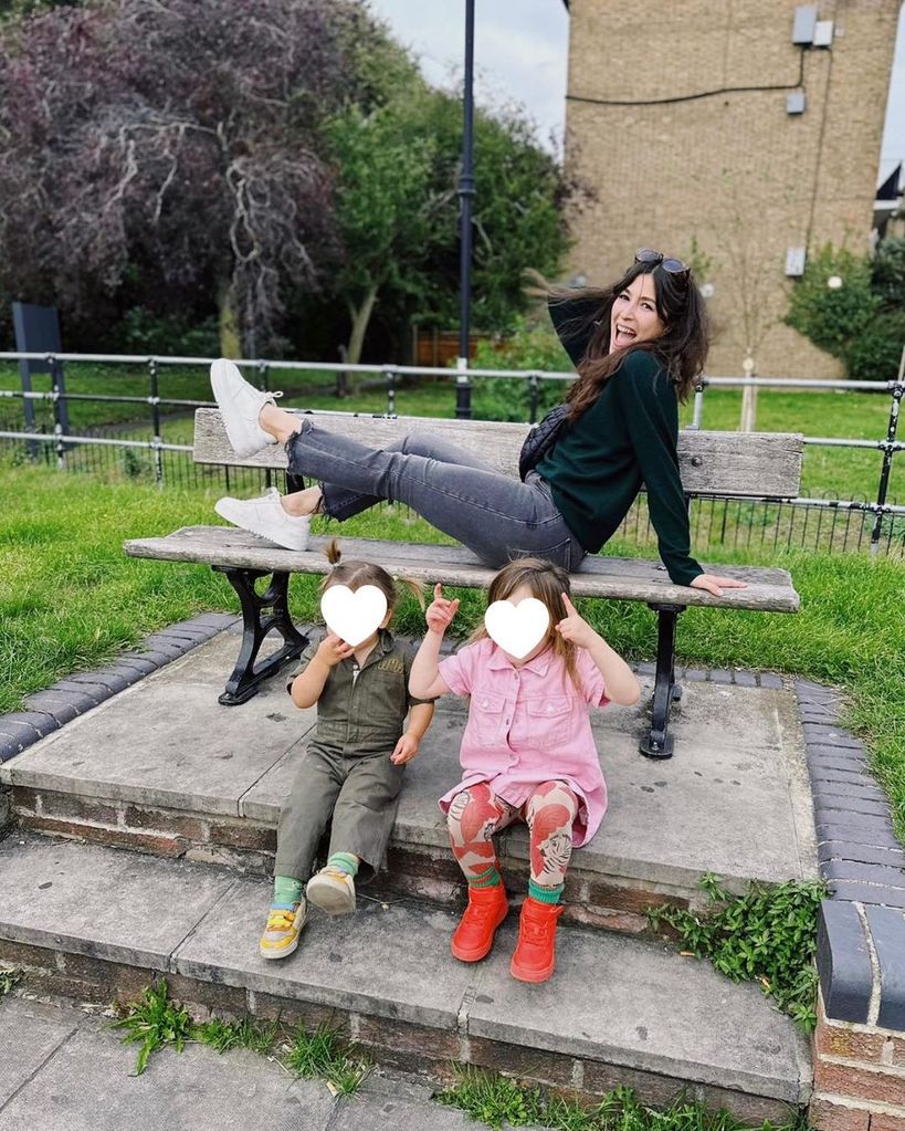 Jazz with her two children during a trip back home to London