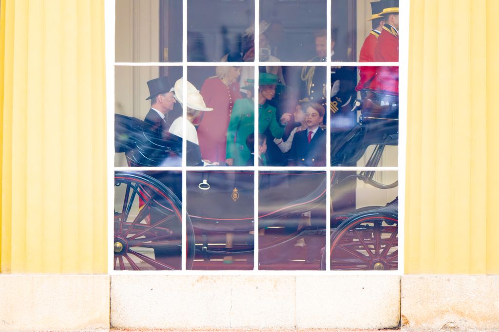 Kate and her children waiting to board a royal carriage