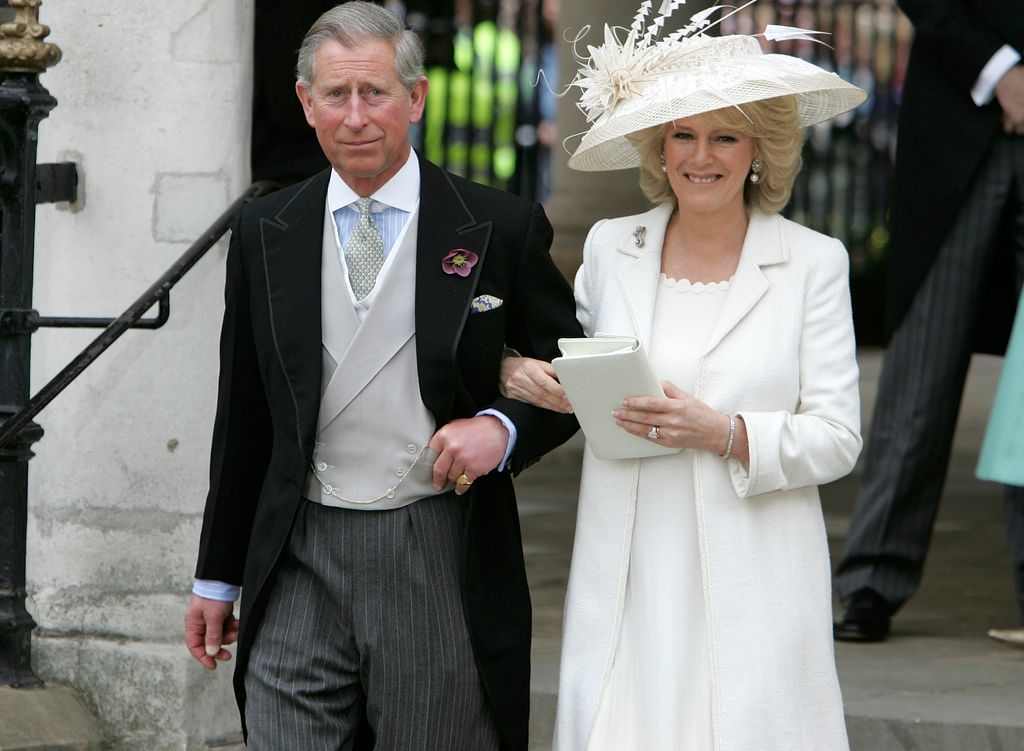 Prince Charles in a suit and Queen Consort Camilla in a white dress for their civil ceremony in April 2005