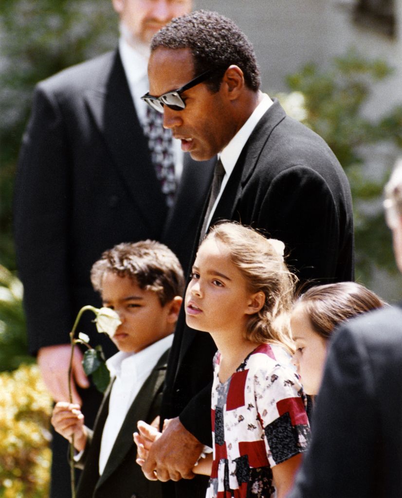 LOS ANGELES - JUNE 16:  Actor, football star O.J. Simpson with his children Justin Simpson and Sydney Simpson at the funeral of their mother, Nicole Brown Simpson on June 16, 1994. In Los Angeles, California. (Photo by Kevin Winter/Getty Images)