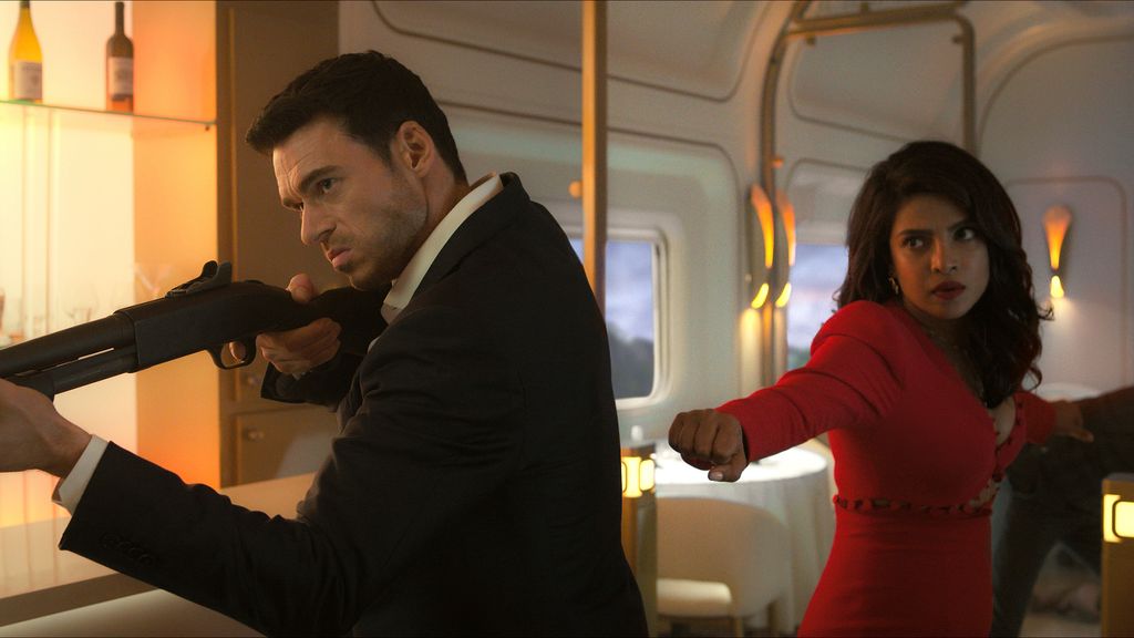 Mason holds a gun while Nadia prepares to fight in epsiode one of Citadel.