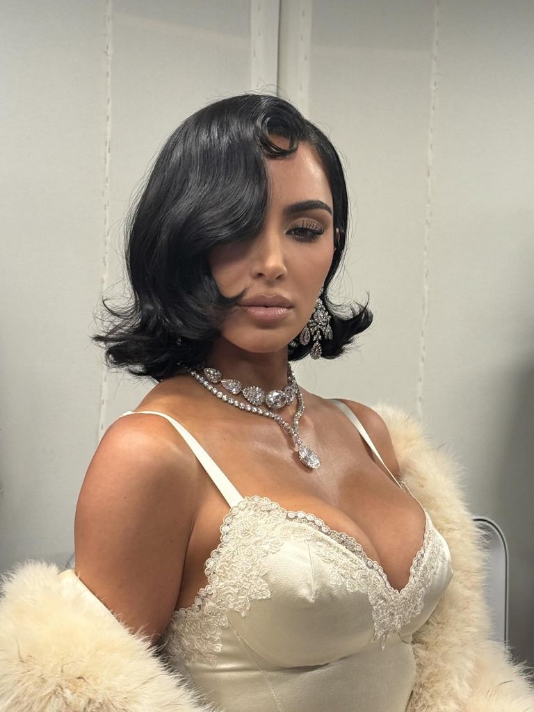 Kim Kardashian walked for Balenciaga wearing Elizabeth Taylor's diamond statement earrings