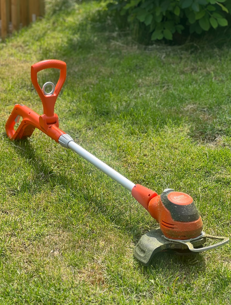  Flymo trimmer on grass