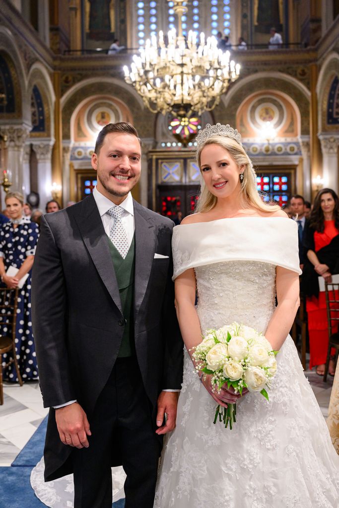 married couple posing on aisle