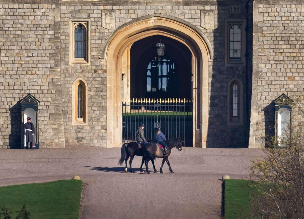 Andrew Mountbatten Windsor is seen out riding with a groom at Windsor Castle today for the first time since losing his royal titles. 