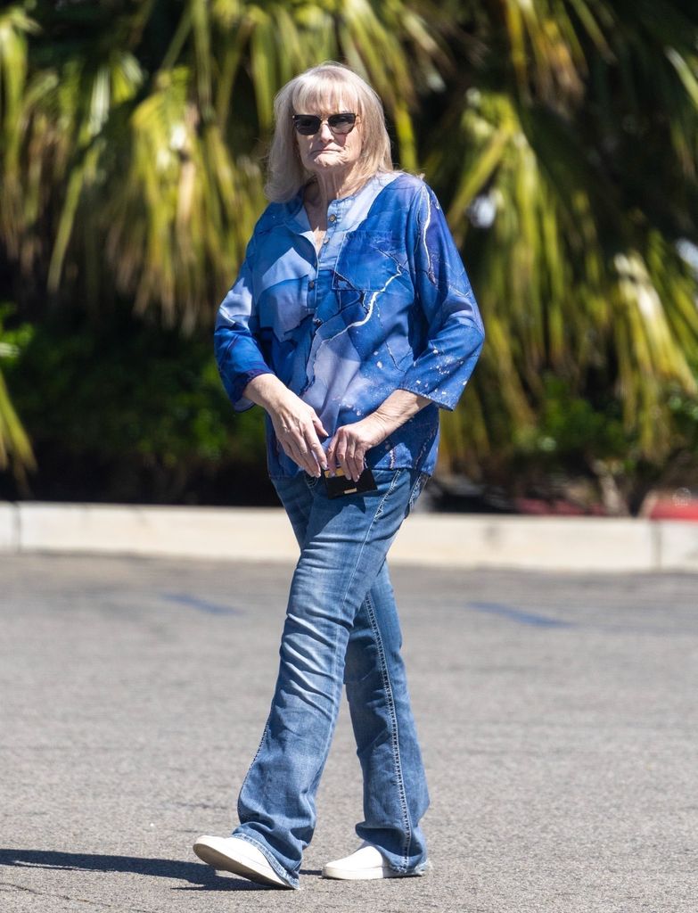 debbie rowe walking through parking lot
