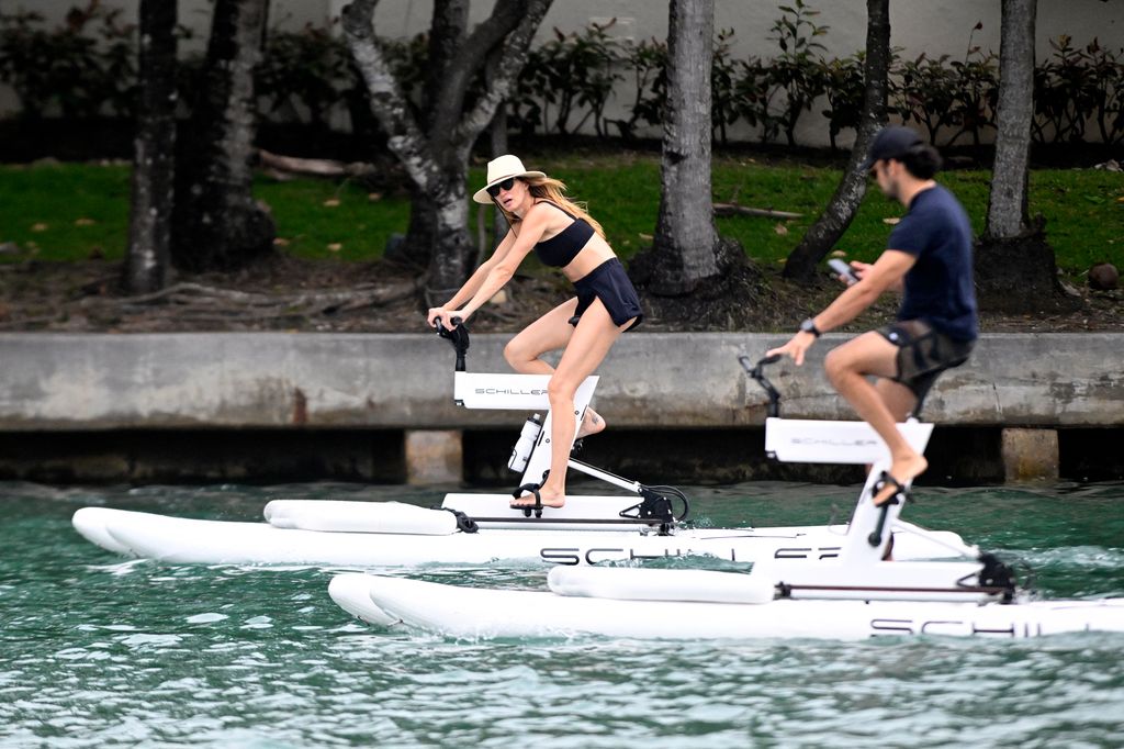 New mom Gisele Bundchen looks amazing as she and partner Joaquim Valente ride water bikes in Miami