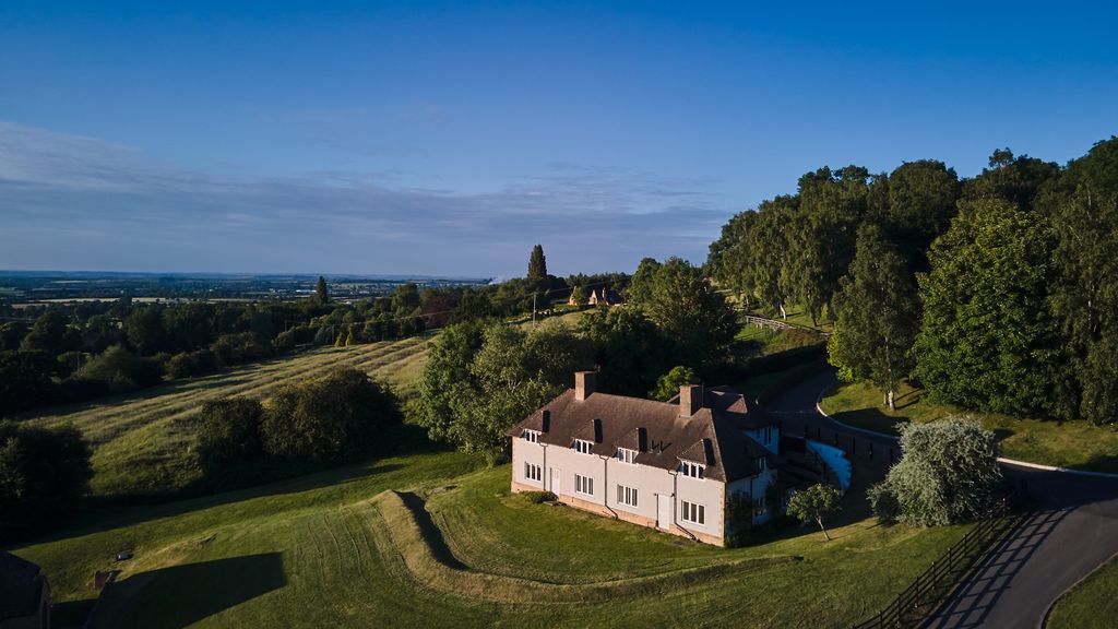 big house in the rolling cotswold hills