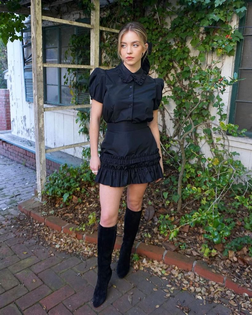 Sydney wearing a mini skirt and shirt set from British label The Vampire's Wife