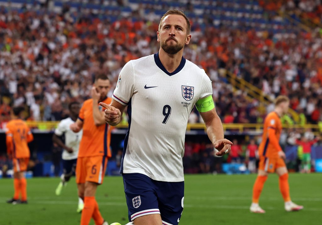 Harry Kane of England celebrates after he scores his team's opening goal from the penalty spot 