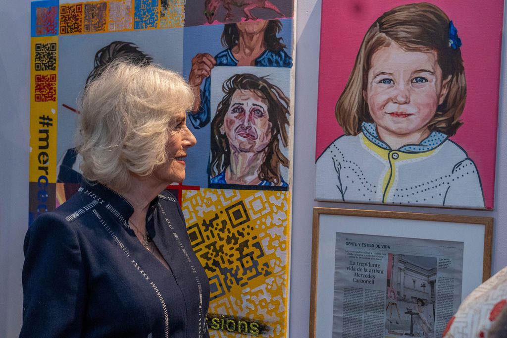 Queen Camilla looks at Princess Charlotte artwork